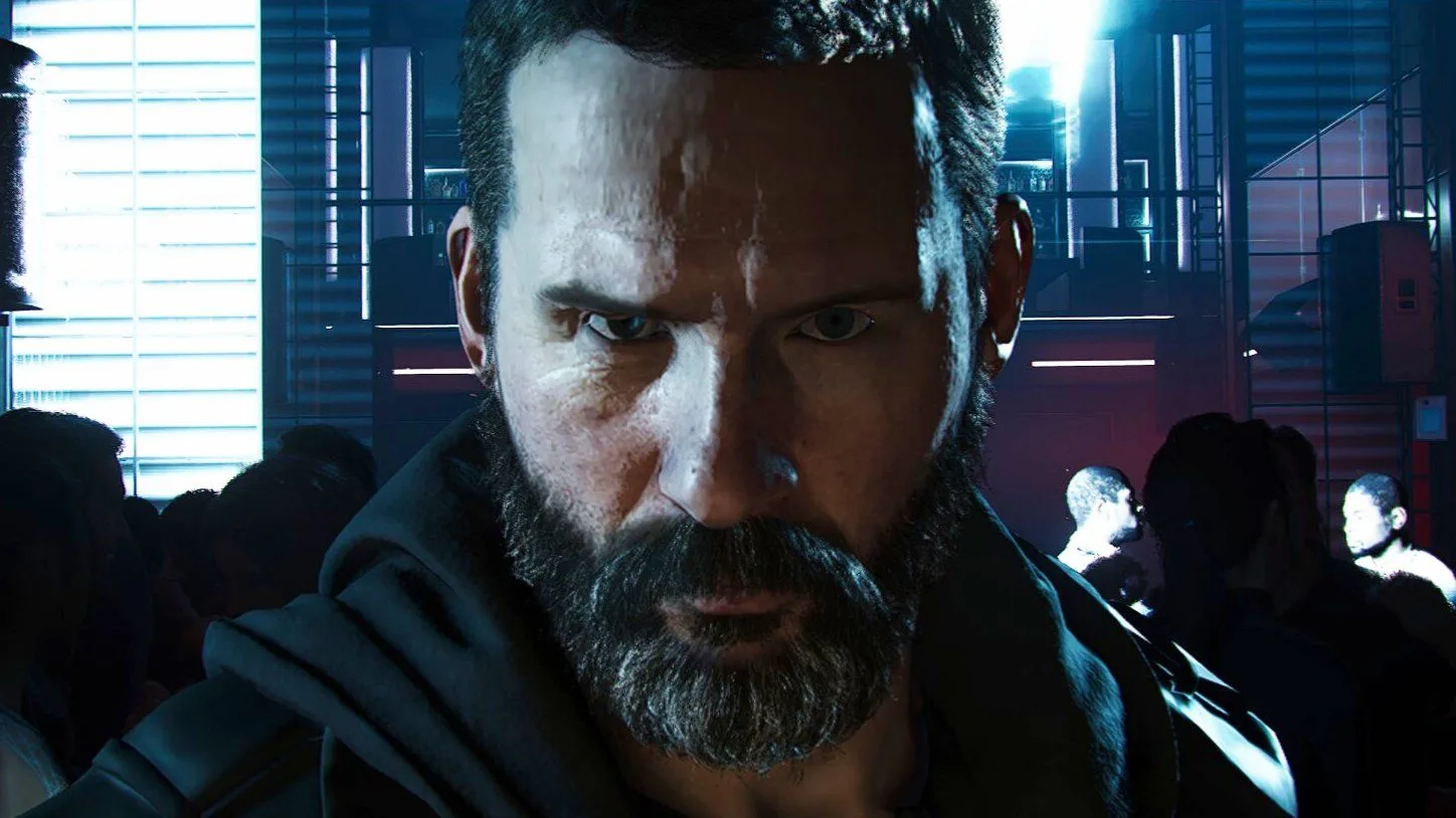A bearded Call of Duty character glaring at the camera in a dark, crowded club