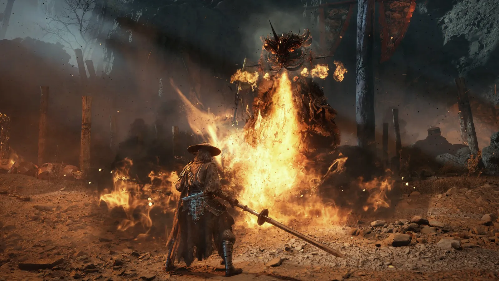 Official Phantom Blade Zero screenshot of a swordsman in a straw hat holding a long weapon as a burst of fire erupts behind him on a burning battlefield